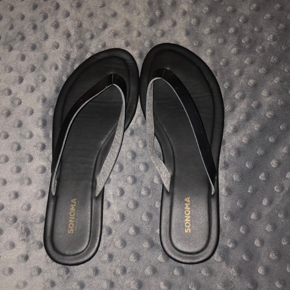Black leather flip flops